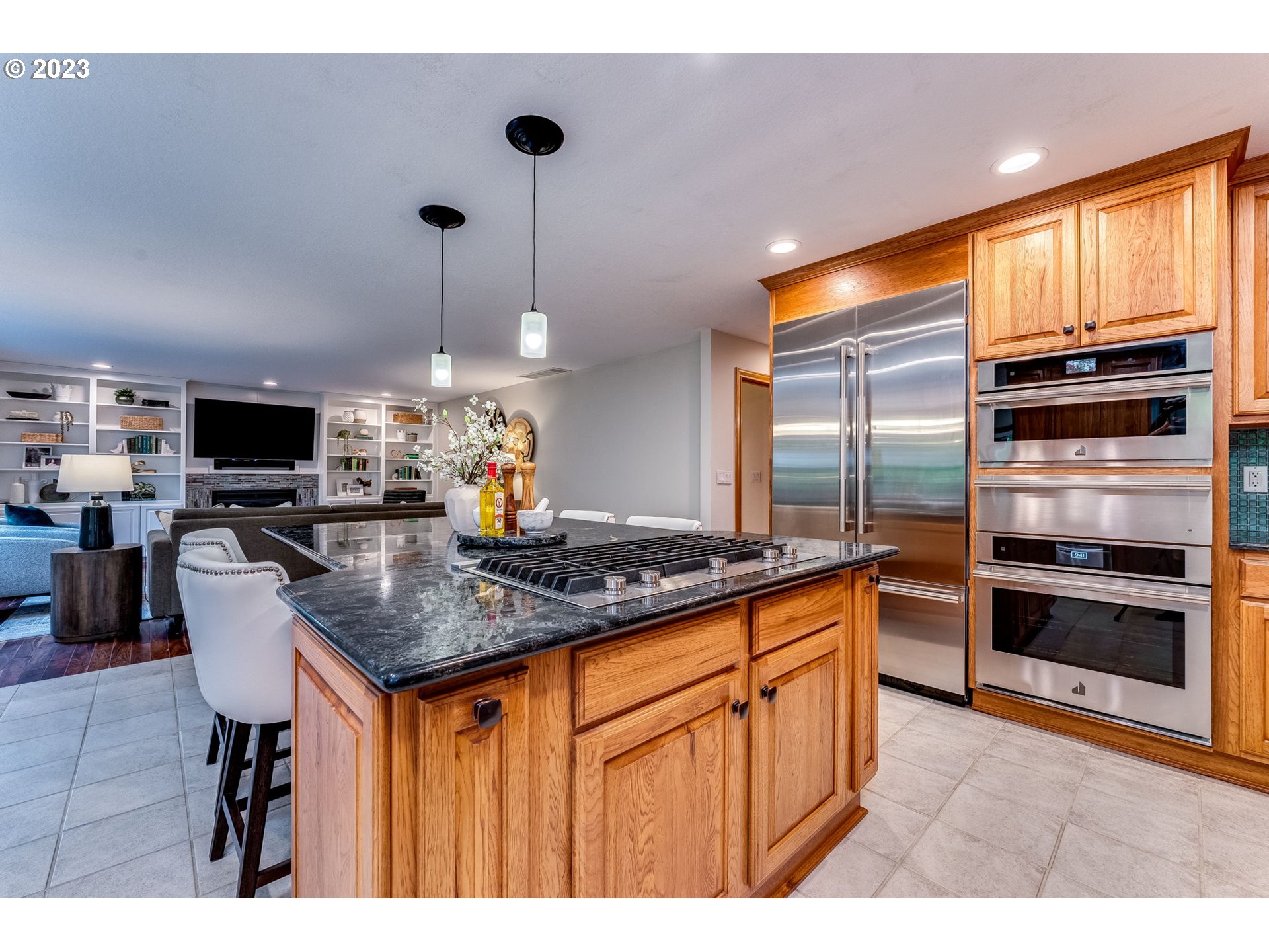 3200 Northeast Jackson Rd Loop Hillsboro, OR 97124 - Photo 10 of 37 a kitchen with stainless steel appliances granite countertop a stove a sink and a refrigerator
