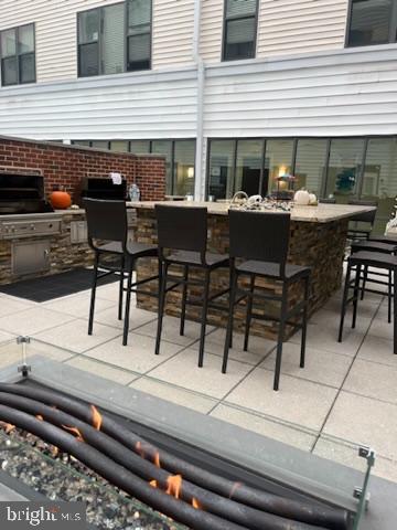 401 Race Street, Unit D Philadelphia, PA 19106 - Photo 20 of 23 a view of a patio with table and chairs and potted plants
