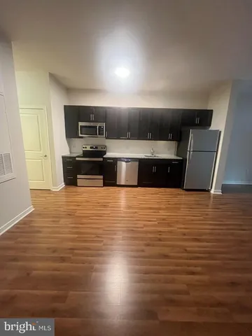 a kitchen with granite countertop cabinets and steel stainless steel appliances