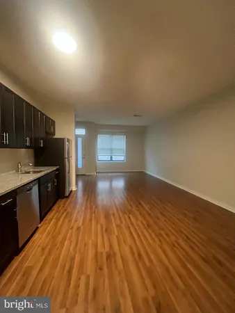 a view of hallway with wooden floor