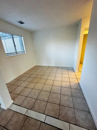 a view of an empty room and window