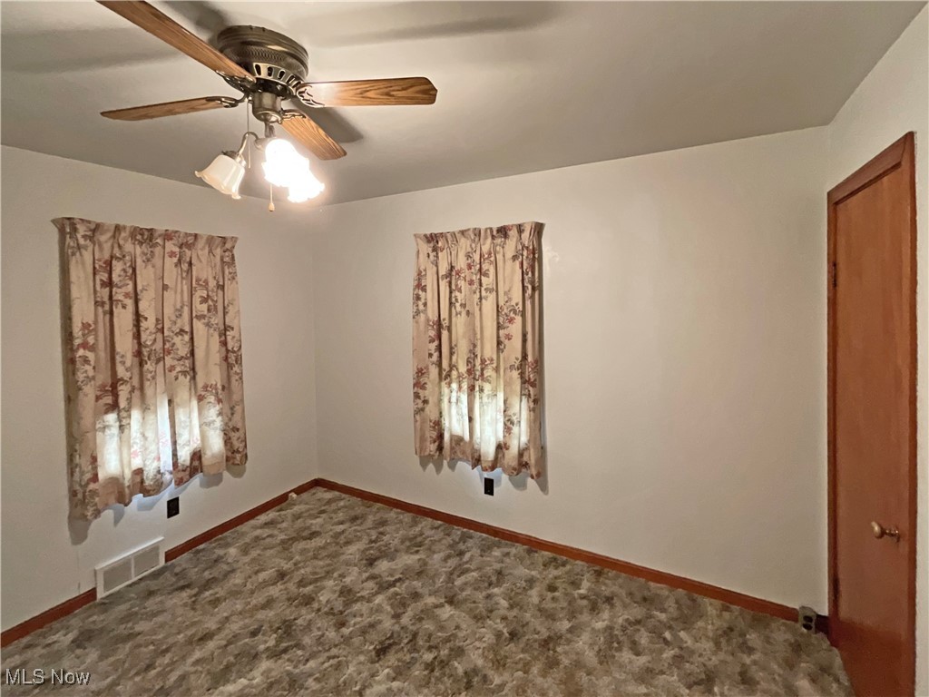 63 Mc Coll Road Colliers, WV 26035 - Photo 8 of 17 Unfurnished room featuring carpet flooring and ceiling fan