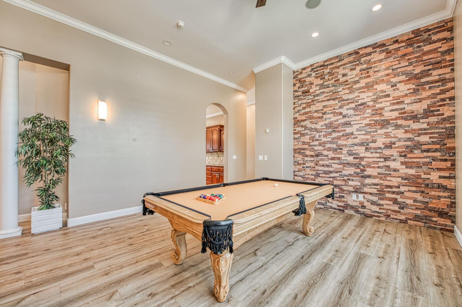 12629 Bronco Road Madera, CA 93636 - Photo 36 of 94 a room with pool table and a wooden floor