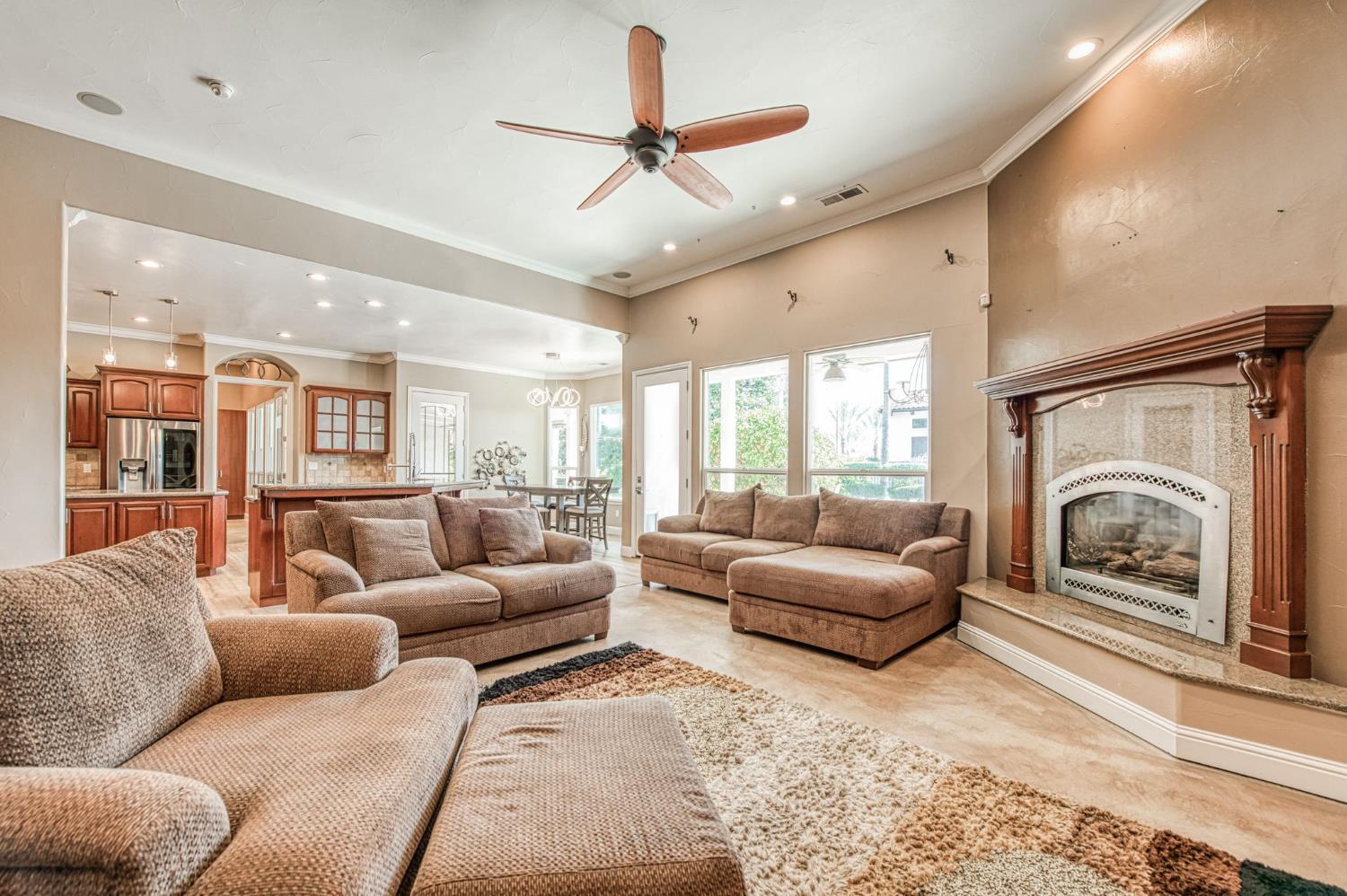 12629 Bronco Road Madera, CA 93636 - Photo 38 of 94 a living room with furniture or couch and a fireplace
