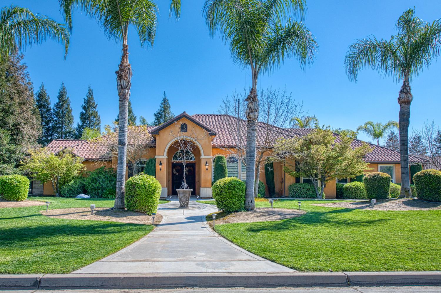 12629 Bronco Road Madera, CA 93636 - Photo 59 of 94 a front view of house with yard and green space