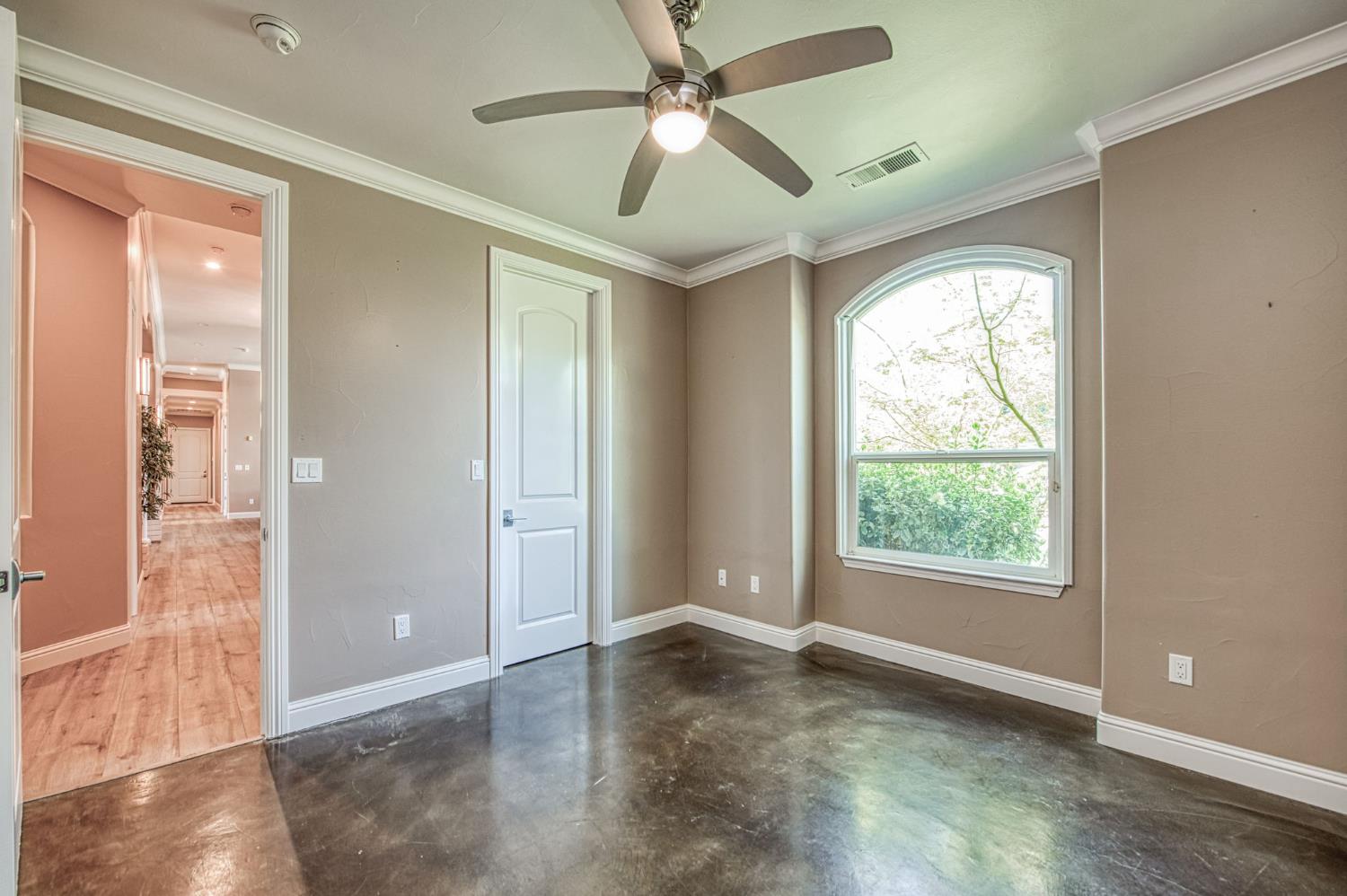 12629 Bronco Road Madera, CA 93636 - Photo 61 of 94 a view of an empty room with glass door and a window