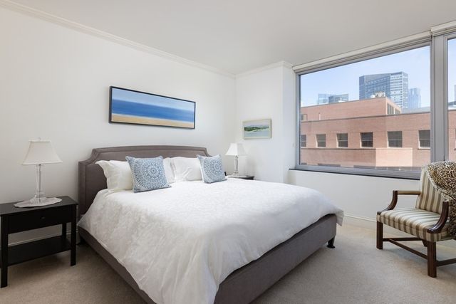 a bedroom with bed and a couch