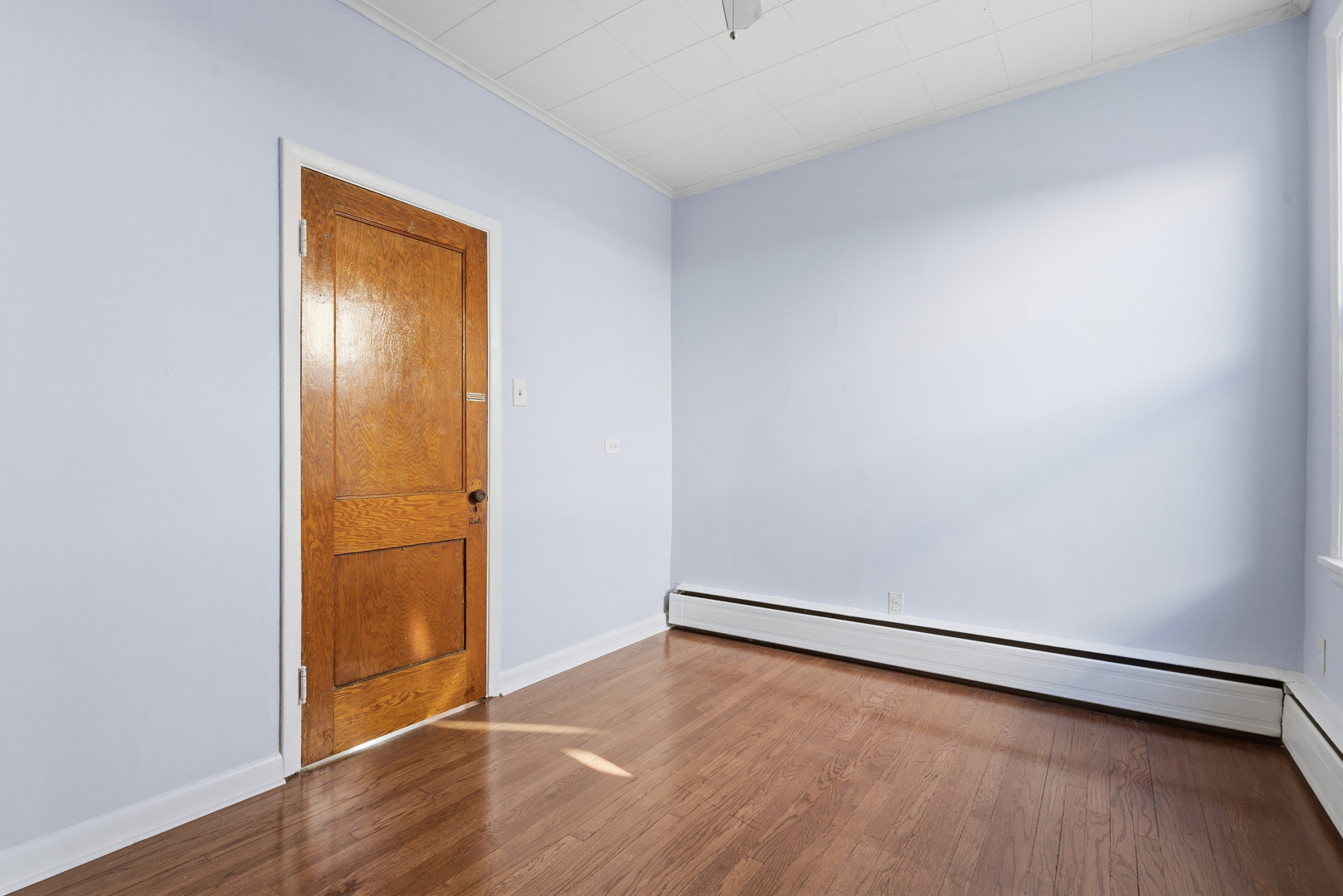 2102 South 50th Avenue Cicero, IL 60804 - Photo 13 of 53 an empty room with wooden floor and closet