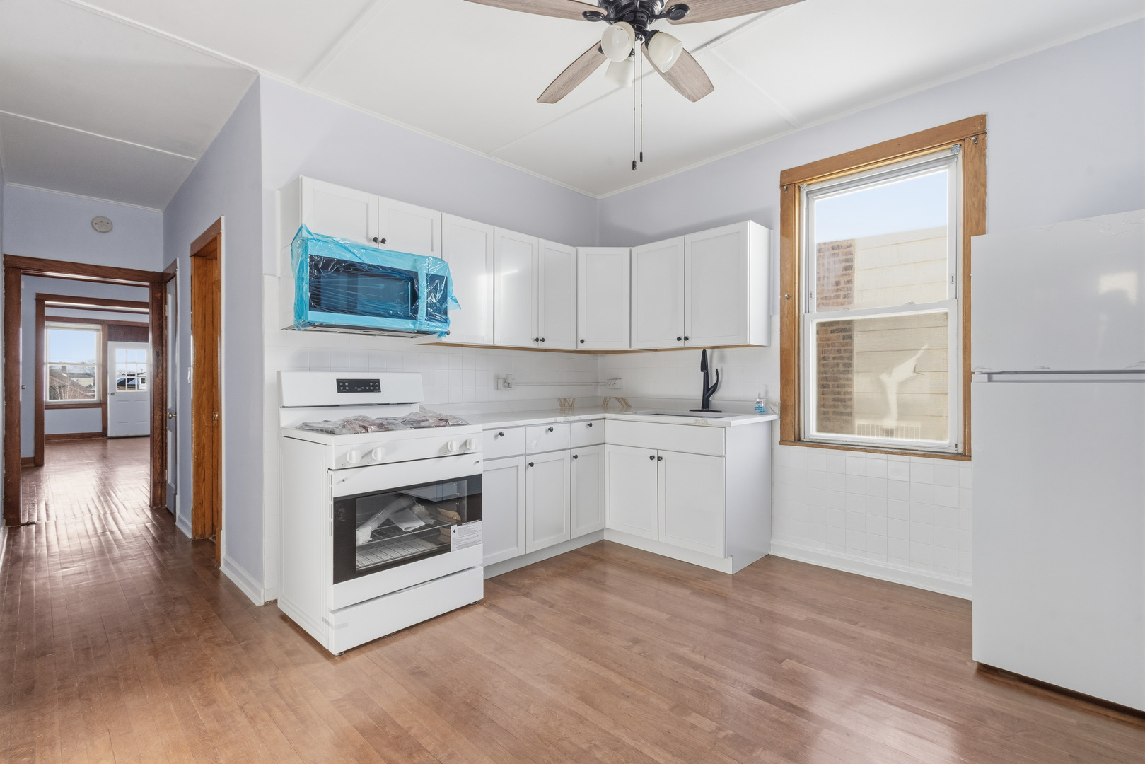 2102 South 50th Avenue Cicero, IL 60804 - Photo 18 of 53 a kitchen with stainless steel appliances a stove top oven and cabinets