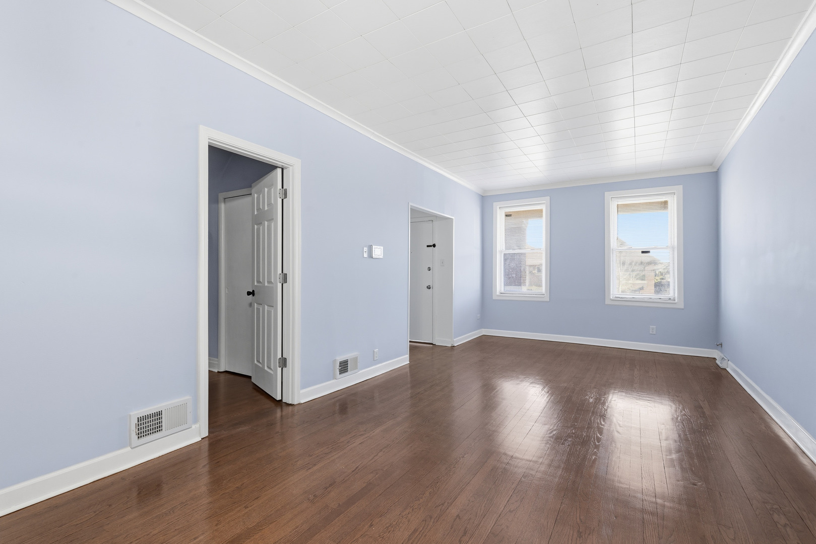 2102 South 50th Avenue Cicero, IL 60804 - Photo 26 of 53 an empty room with wooden floor & windows