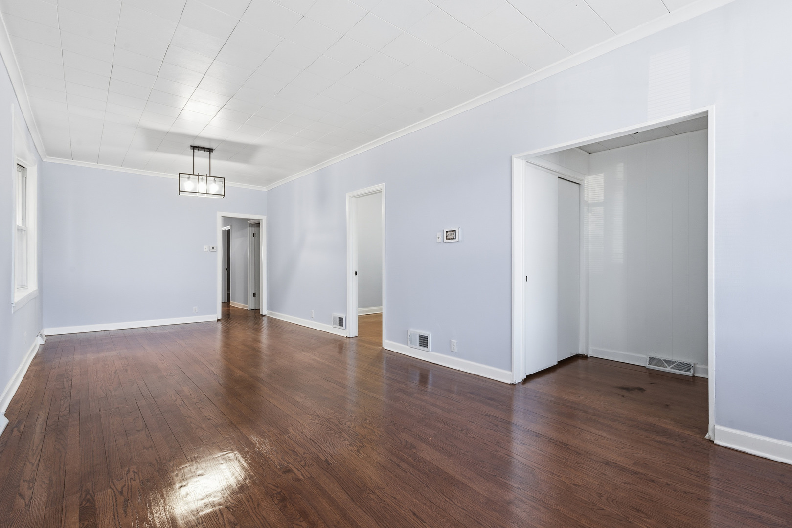 2102 South 50th Avenue Cicero, IL 60804 - Photo 27 of 53 a view of an empty room with wooden floor
