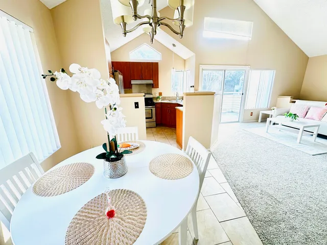 a view of pool with tall trees