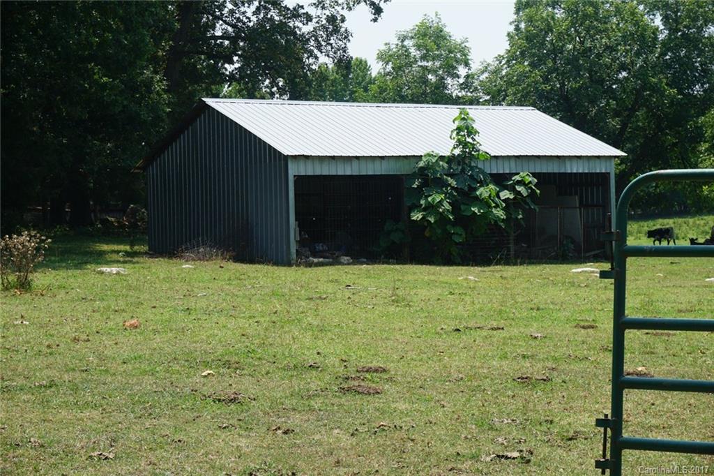 1823 Wisdom Road Lancaster, SC 29720 - Photo 20 of 23 a front view of house with yard and trees