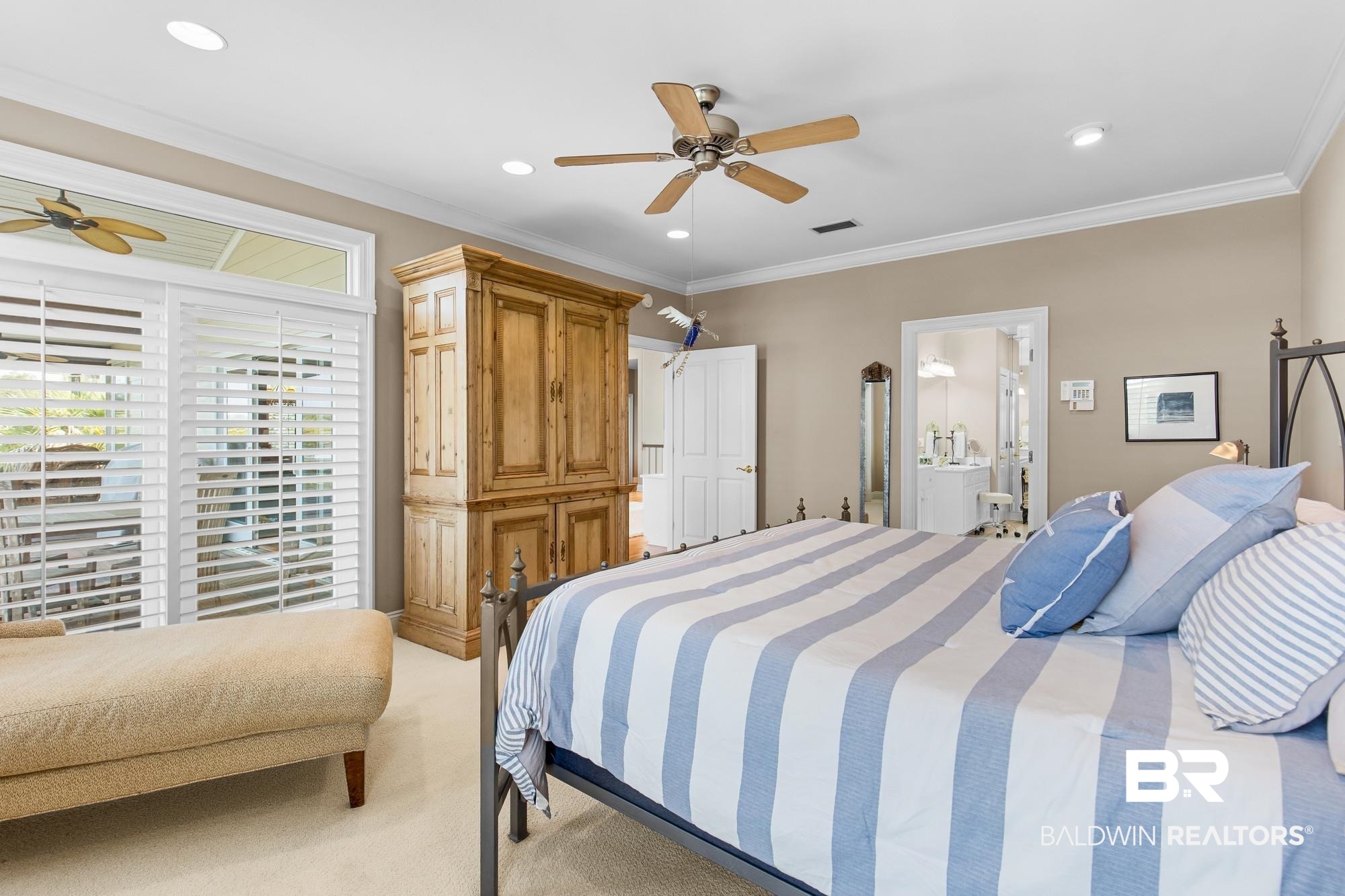 32191 River Road Orange Beach, AL 36561 - Photo 21 of 46 Bedroom with crown molding, light carpet, ceiling fan, recessed lighting, and connected bathroom
