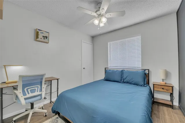 a bedroom with a bed and a chair