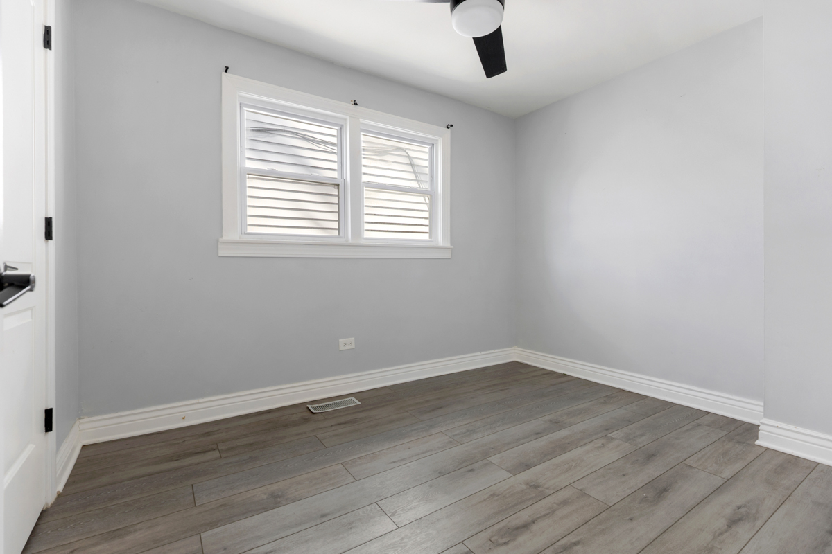 245 West 43rd Street Chicago, IL 60609 - Photo 14 of 26 wooden floor in an empty room with a window