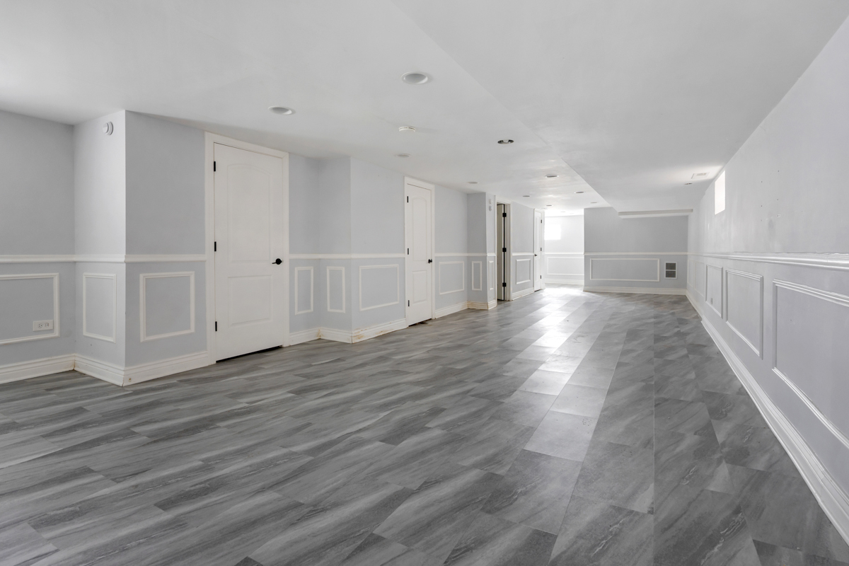 245 West 43rd Street Chicago, IL 60609 - Photo 16 of 26 a view of a hallway with wooden floor