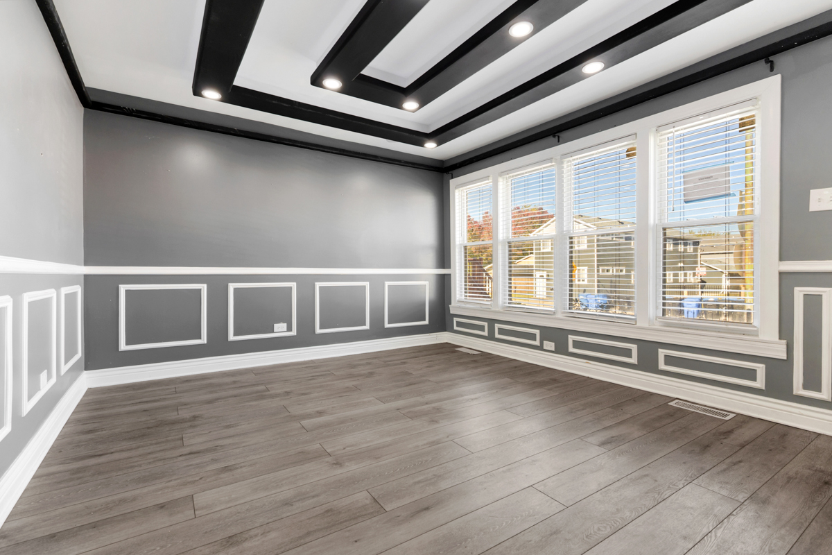 245 West 43rd Street Chicago, IL 60609 - Photo 4 of 26 a view of an empty room with wooden floor and a window