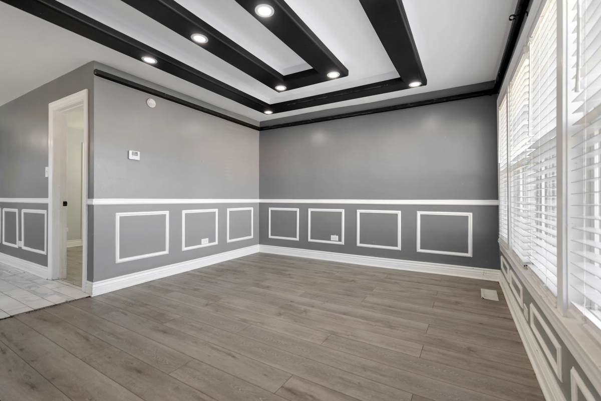 245 West 43rd Street Chicago, IL 60609 - Photo 5 of 26 a view of an empty room with wooden floor and a window