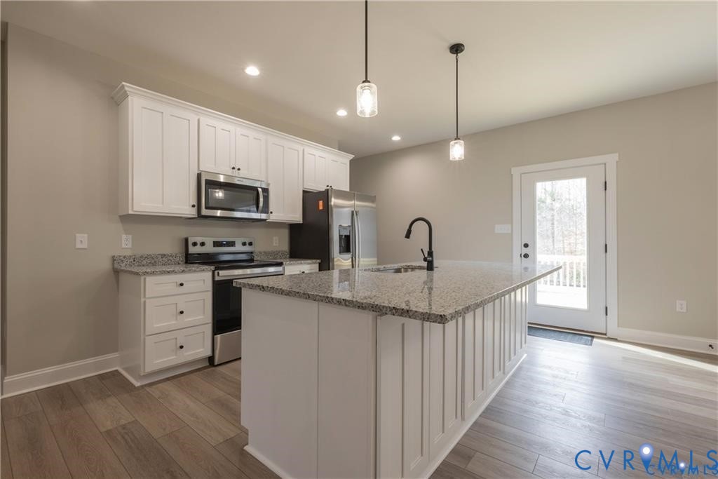 2223 Ridge Road Arvonia, VA 23004 - Photo 14 of 32 Kitchen featuring a central island with a granite