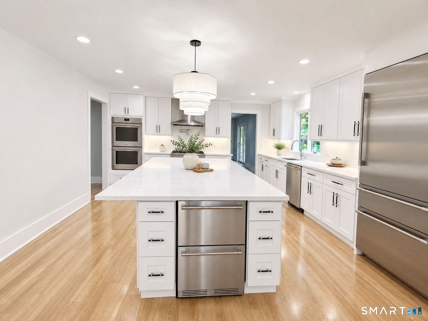 29 Flint Rock Road Stamford, CT 06903 - Photo 4 of 34 Thermador Appliances (propane cooktop, double-wall oven, dishwasher, fridge/freezer), oversized island, quartz countertops, refrigerator drawers, built-in pot filler, pendant lighting, under-cabinet lighting, etc.