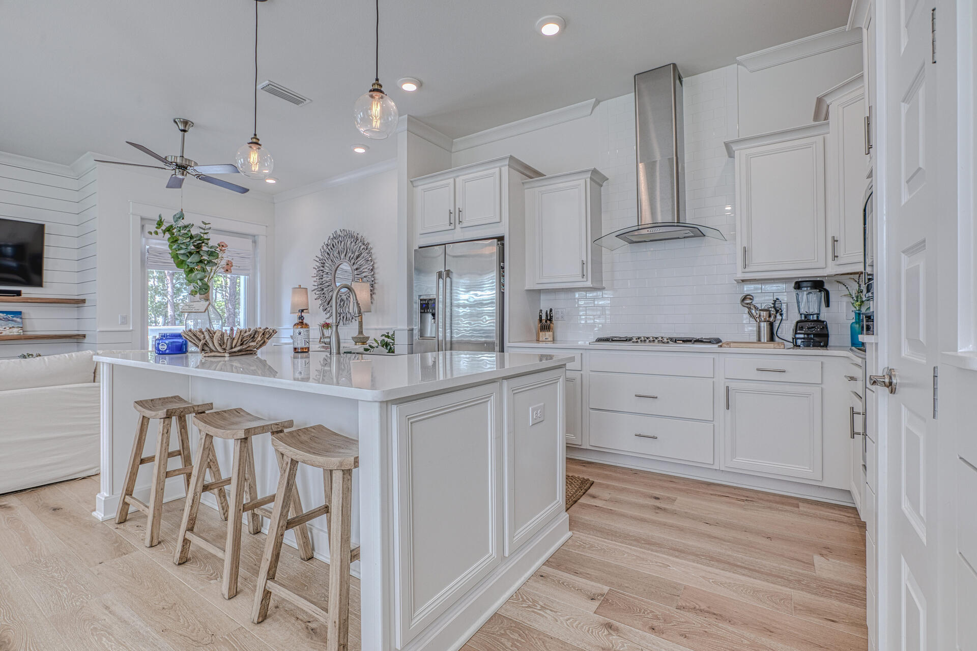 141 Pine Lands Loop Inlet Beach, Unit A Inlet Beach, FL 32461 - Photo 1 of 44 a kitchen with white cabinets and stainless steel appliances