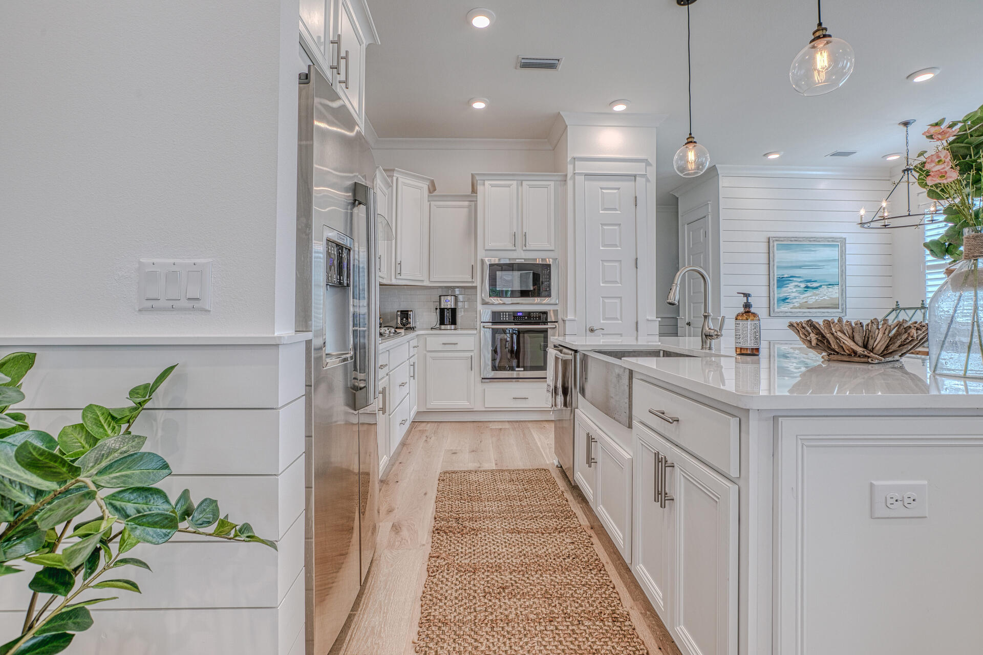 141 Pine Lands Loop Inlet Beach, Unit A Inlet Beach, FL 32461 - Photo 13 of 44 a large white kitchen with lots of counter space and stainless steel appliances