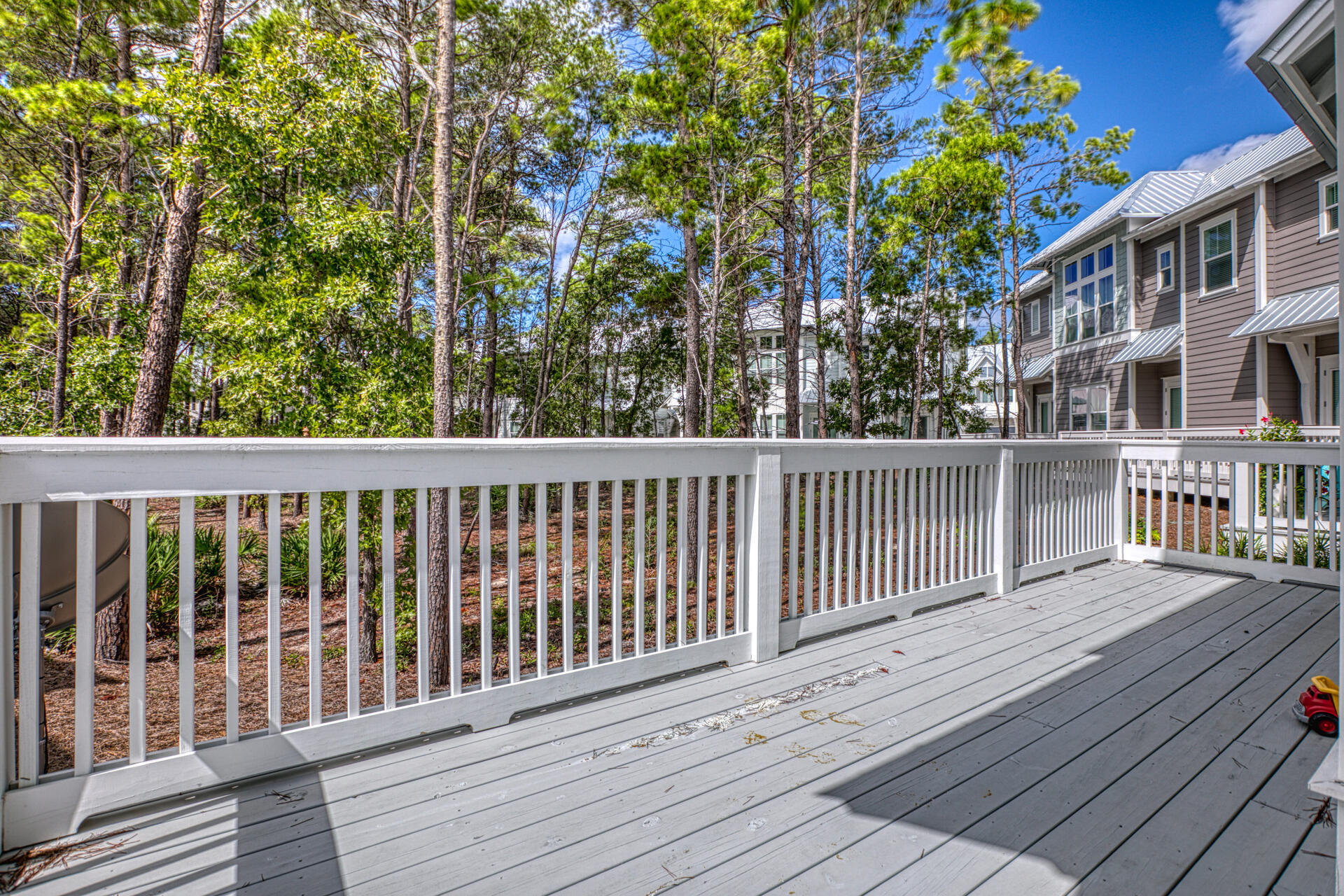 141 Pine Lands Loop Inlet Beach, Unit A Inlet Beach, FL 32461 - Photo 16 of 44 a view of a wooden roof deck