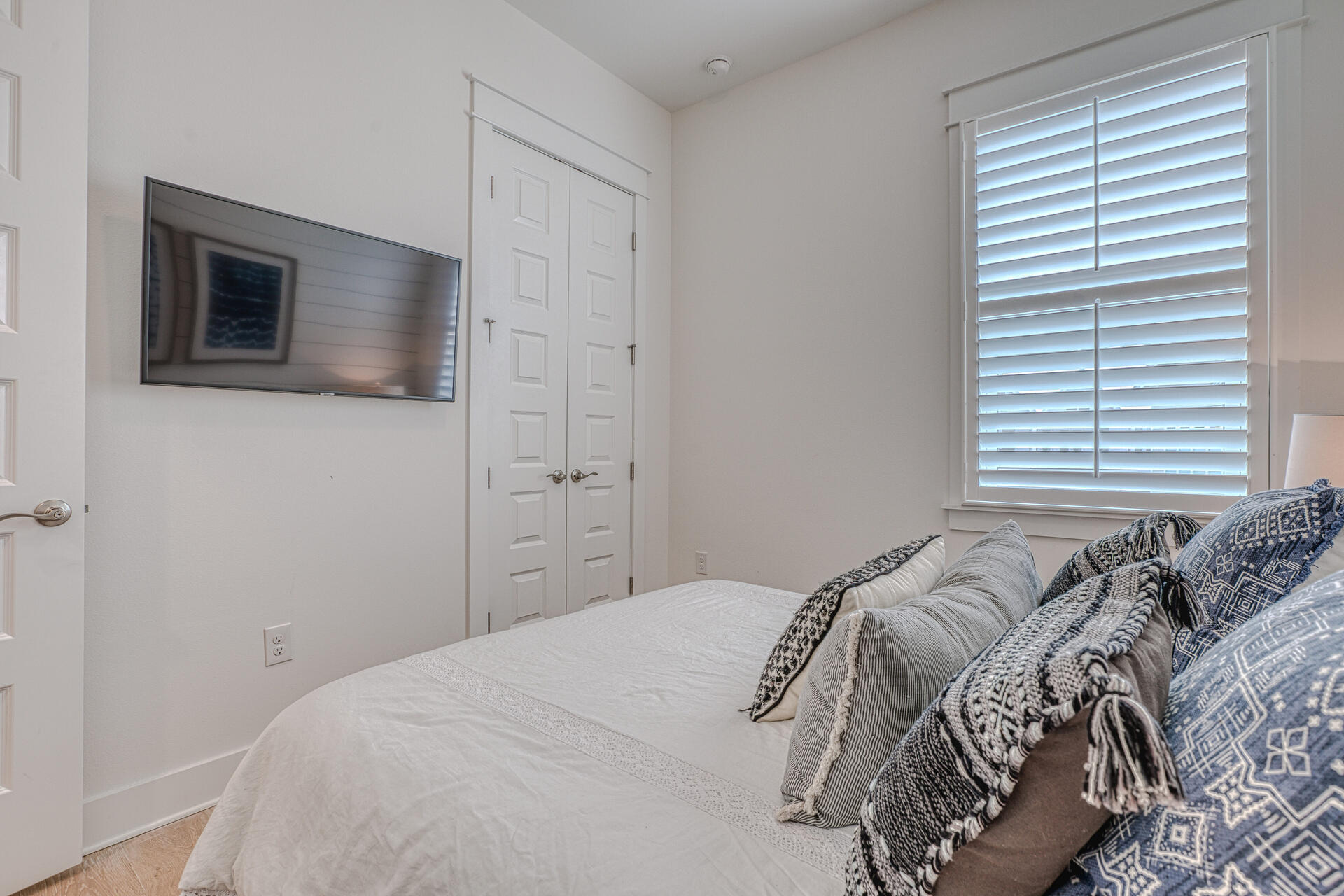 141 Pine Lands Loop Inlet Beach, Unit A Inlet Beach, FL 32461 - Photo 24 of 44 a bedroom with a bed and a window
