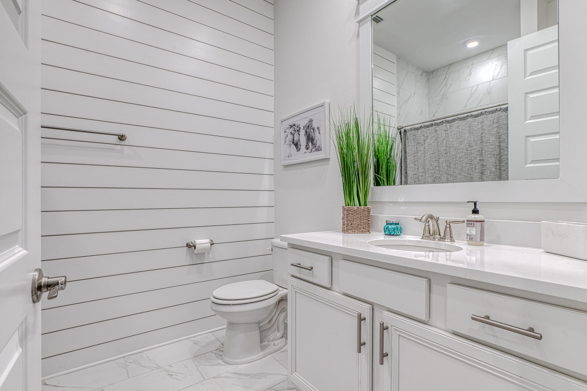 141 Pine Lands Loop Inlet Beach, Unit A Inlet Beach, FL 32461 - Photo 25 of 44 a bathroom with a toilet sink vanity and mirror