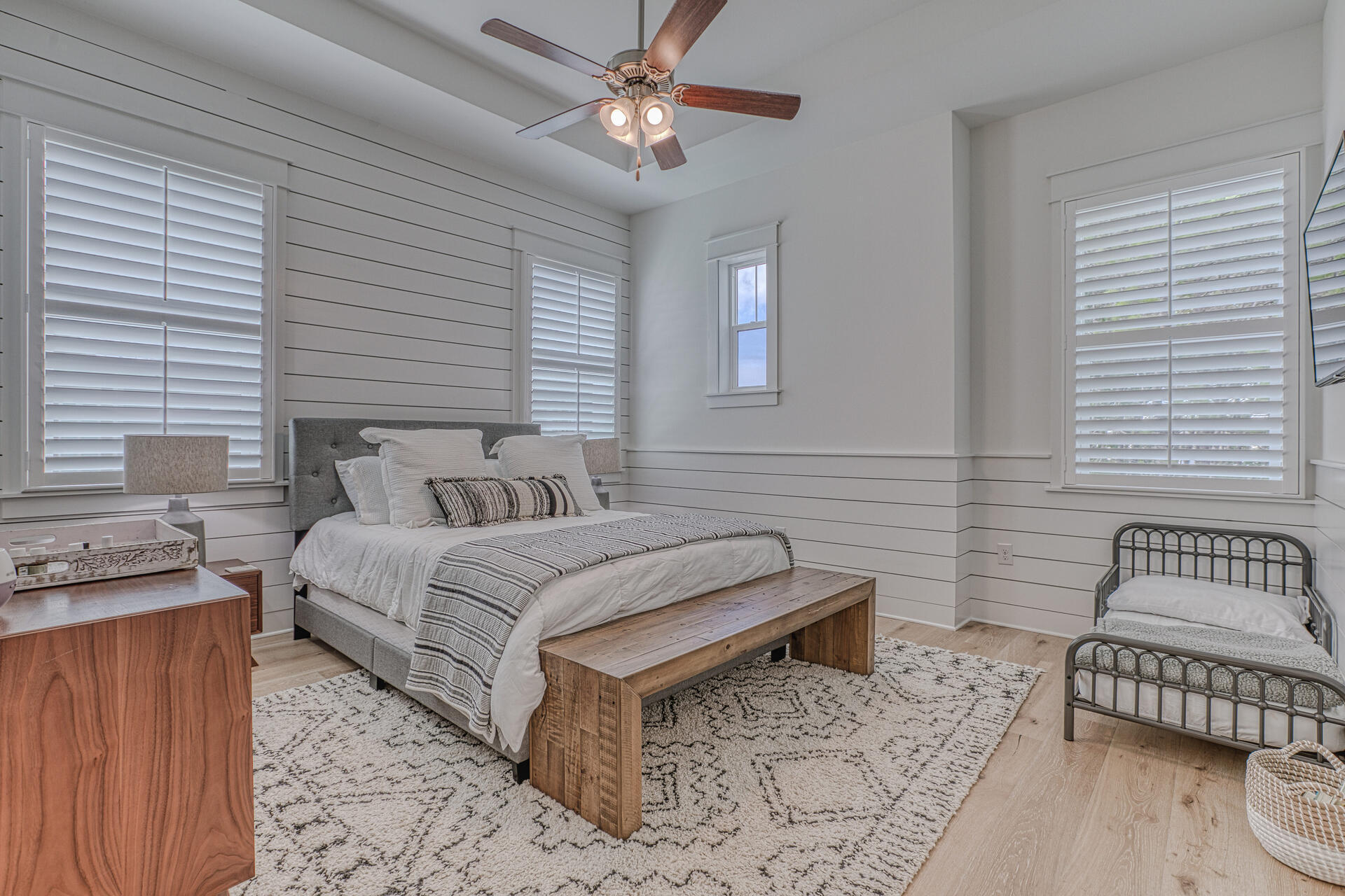 141 Pine Lands Loop Inlet Beach, Unit A Inlet Beach, FL 32461 - Photo 26 of 44 a spacious bedroom with a bed and a couch