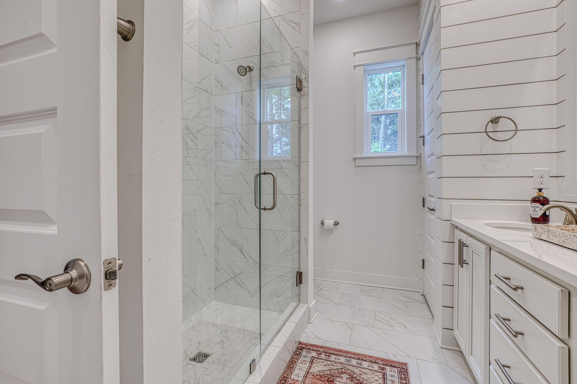 141 Pine Lands Loop Inlet Beach, Unit A Inlet Beach, FL 32461 - Photo 29 of 44 a bathroom with a shower and a sink