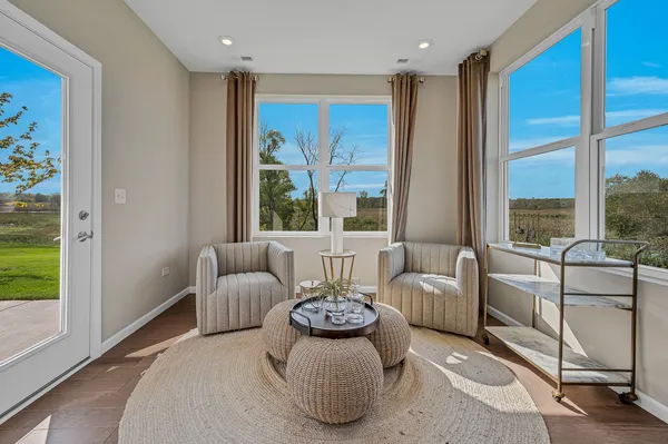 a living room with furniture and a large window