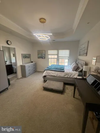 a bedroom with furniture and window