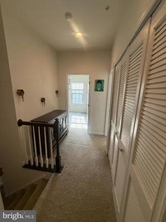 a view of a hallway with windows