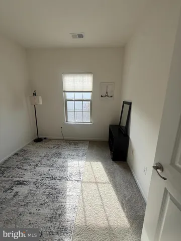 a view of a balcony with furniture