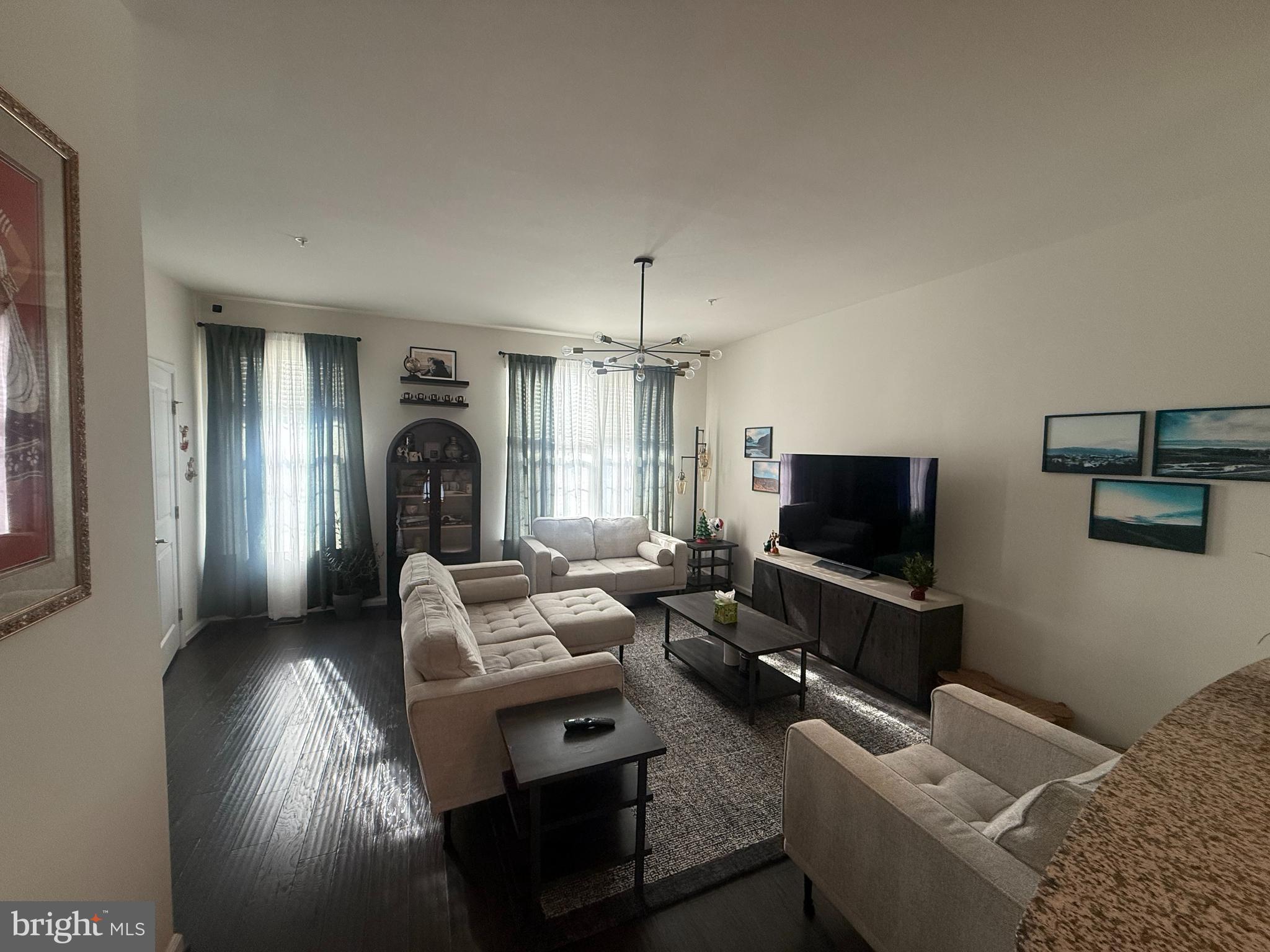 2784 Fredericksburg Road Hanover, MD 21076 - Photo 35 of 39 a living room with furniture and a flat screen tv