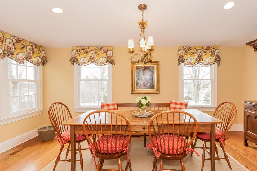 39 Brushy Ridge Road New Canaan, CT 06840 - Photo 18 of 57 a dining room with furniture a chandelier and wooden floor
