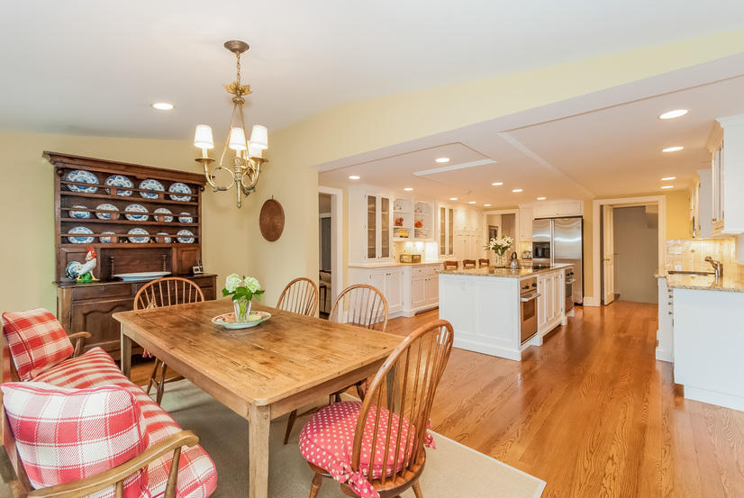39 Brushy Ridge Road New Canaan, CT 06840 - Photo 19 of 57 a view of a dining room and livingroom with furniture wooden floor a chandelier