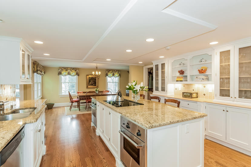 39 Brushy Ridge Road New Canaan, CT 06840 - Photo 22 of 57 a kitchen with stainless steel appliances granite countertop a lot of counter space and wooden floors