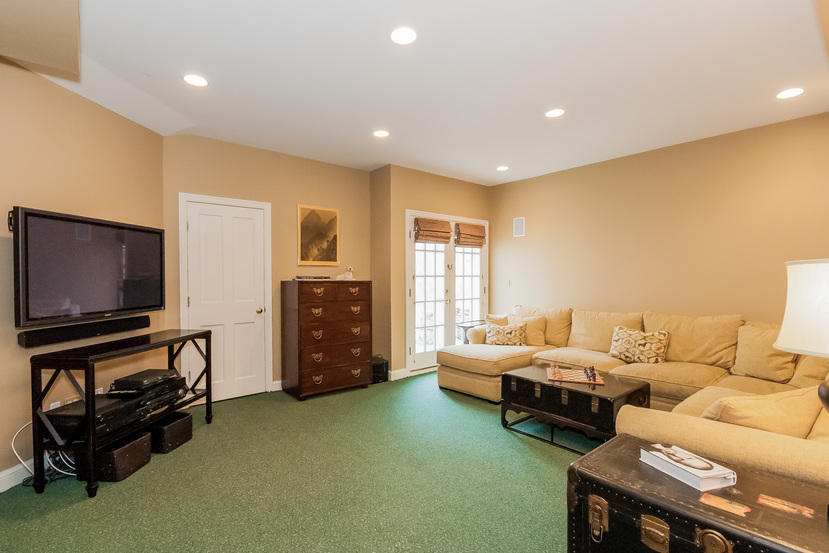 39 Brushy Ridge Road New Canaan, CT 06840 - Photo 45 of 57 a living room with furniture and a flat screen tv