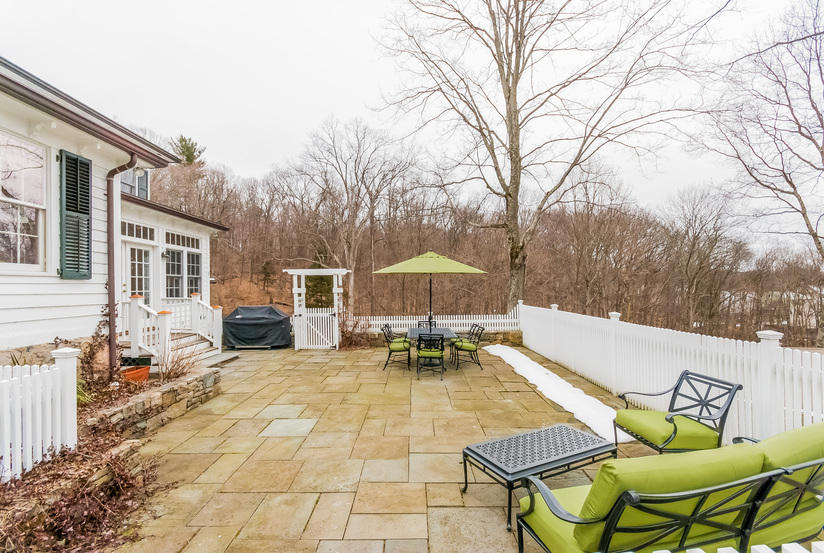 39 Brushy Ridge Road New Canaan, CT 06840 - Photo 51 of 57 a swimming pool with outdoor seating and yard
