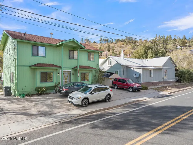 a bed room with a bed and a chair