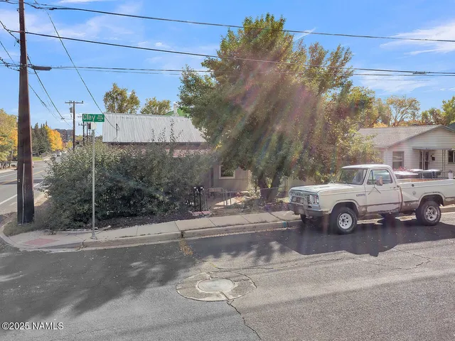 a view of street with parked cars