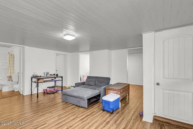 a large bathroom with a tub a sink and a large mirror