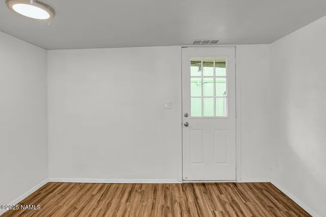 a bathroom with a sink vanity mirror and toilet