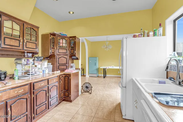 a bathroom with a shower curtain and a window