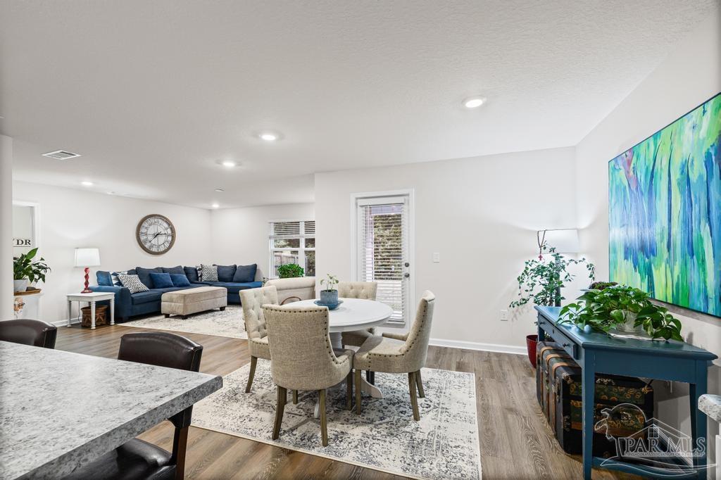 5443 Peach Drive Pace, FL 32571 - Photo 18 of 34 a living room with furniture potted plant and a window