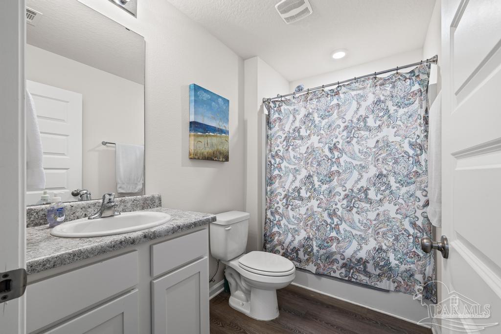 5443 Peach Drive Pace, FL 32571 - Photo 25 of 34 a bathroom with a sink toilet and shower