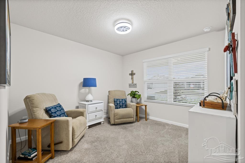 5443 Peach Drive Pace, FL 32571 - Photo 27 of 34 a living room with furniture and a window